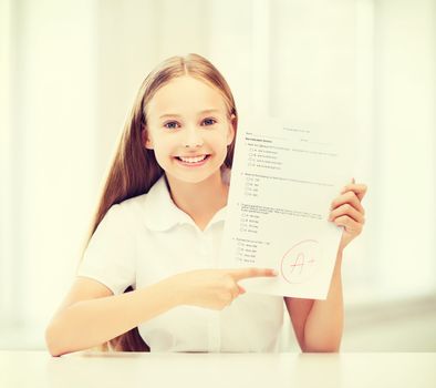 girl with test and grade at school