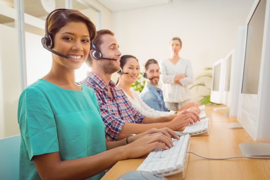 Call center agent working under a manager supervision 
