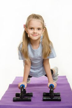 Six year old girl pushed with stops for push-ups
