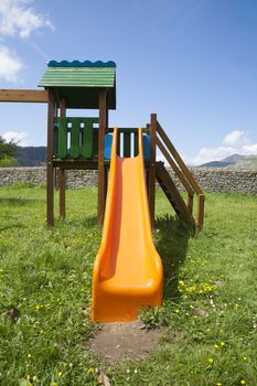 orange slide in grass