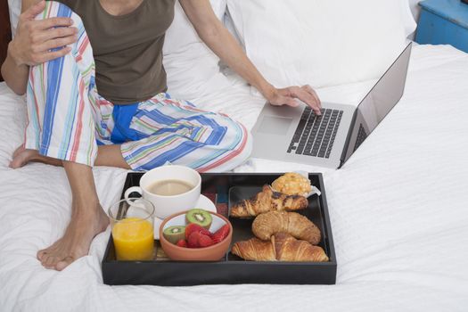 bed laptop and breakfast