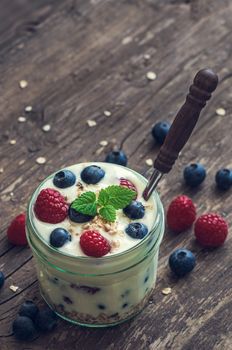 Yogurt with Fresh Berries on Woden Table