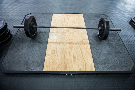 A barbell next to weights