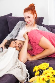 Young Couple Relaxing on Couch In the Living Room