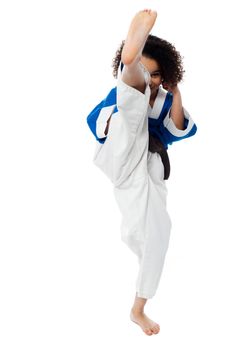 Karate girl kick a leg