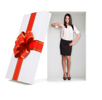 Businesslady looking at camera in gift box