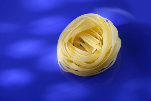 Uncooked pasta tagliatelle