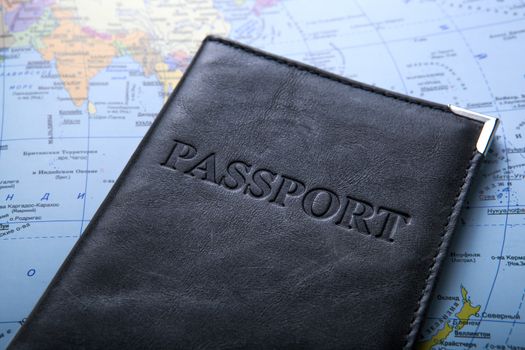 passport in the bag on a map 