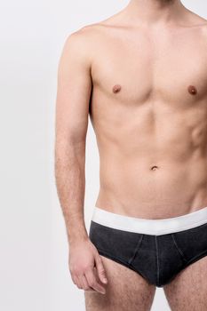 Fit male posing in underwear