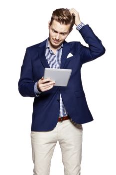 Worried man using digital tablet 