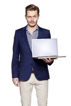 Businessman holding his laptop 