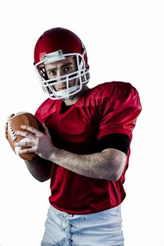 Portrait of american football player being about to throw football