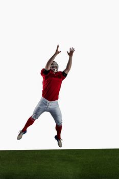 American football player trying to catch football