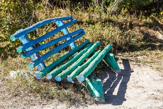 Unusual wooden bench handmade in a forest glade
