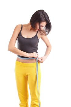 Woman measures her waist