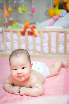 Asian baby girl scowl and tongue out