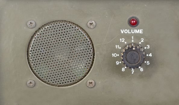 old dial volume switch with speaker and red light indicator