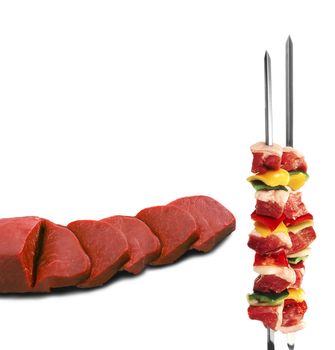 shish kebab on skewers and raw meat