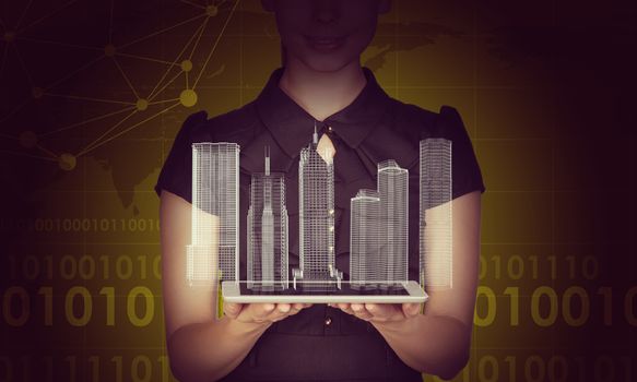 Businesslady holding tablet and 3d city model