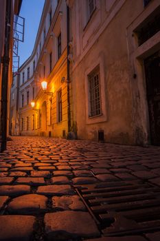 Prague street at night with sewer