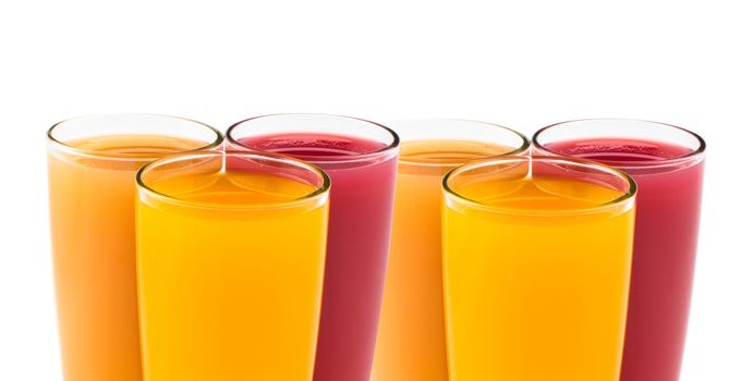 Tropical juices in glasses close up