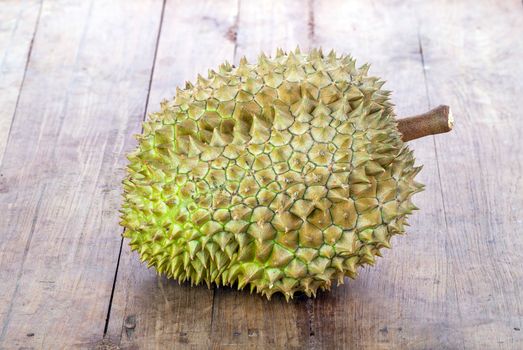 fresh green Durian on wooden plate
