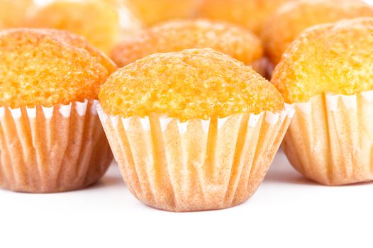 Delicious mini muffins on a white background