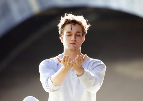 Portrait of a Young Man Exercising Yoga 