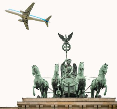 Airplane overflying Berlin Quadriga over Brandenburg Gate