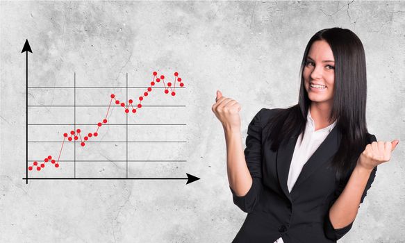 Smiling businesswoman with graph