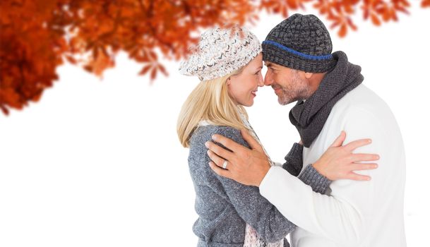 Composite image of smiling cute couple romancing over white background