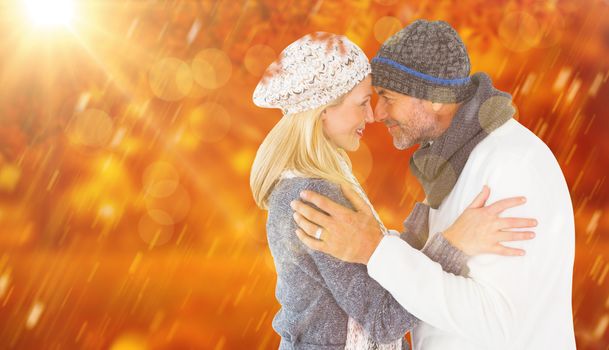Composite image of smiling cute couple romancing over white background