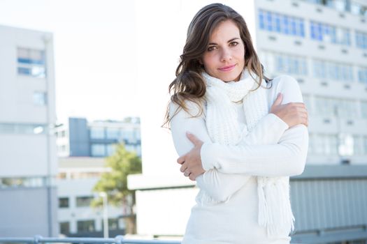Pretty woman with warm clothes looking at camera 
