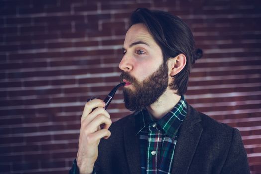  Fashionable man smoking pipe