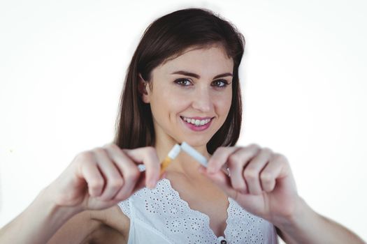 Woman snapping cigarette in half