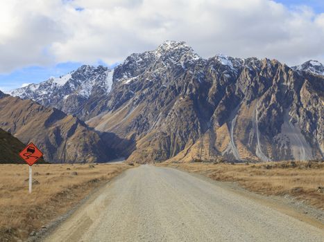 Gravel road to high mountains, New Zealand.