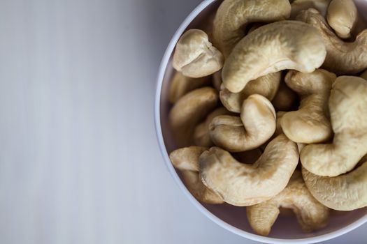 Portion cup of cashew nuts
