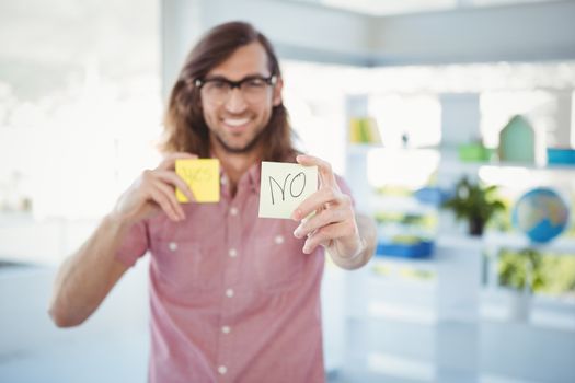 Hipster holding adhesive note with no sign