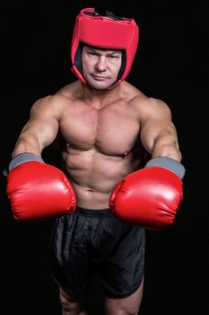 Portrait of boxer with red gloves and headgear