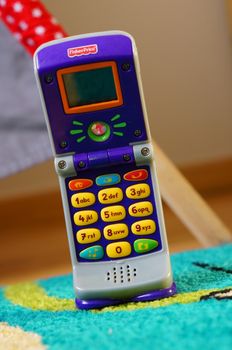 POZNAN, POLAND - AUGUST 20, 2015: Fisher Price plastic toy phone