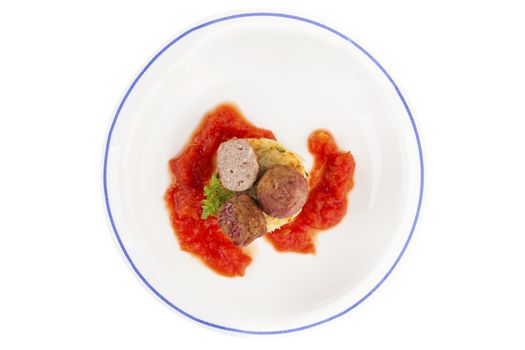 Meatballs with tomato sauce and mashed potatoes on plate isolated on white background, top view. Traditional mediterranean eating. 