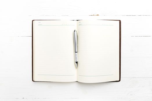 open notebook with pen