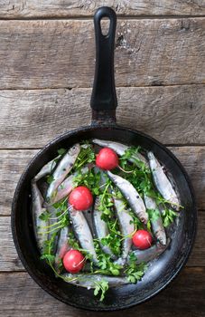 Raw fish in the pan