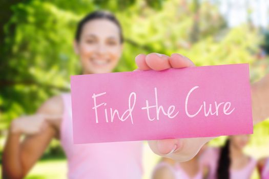 Find the cure against smiling women in pink for breast cancer awareness