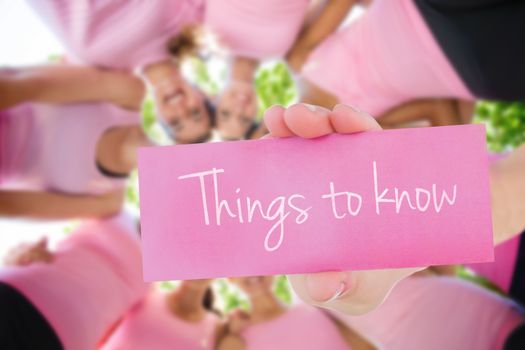 Things to know against smiling women organising event for breast cancer awareness
