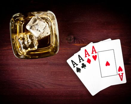 top of view of poker playing cards near wiskey glass