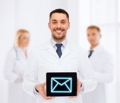 smiling male doctor with tablet pc