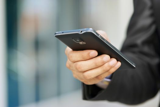 Business Man Holding Phablet Smartphone And Watching E-mail