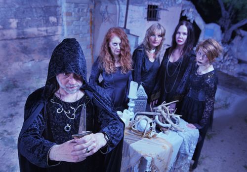 Wicca Priest and Coven in Ritual