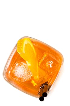top of view of glass of spritz aperitif aperol cocktail with orange slices and ice cubes on white background with space for text